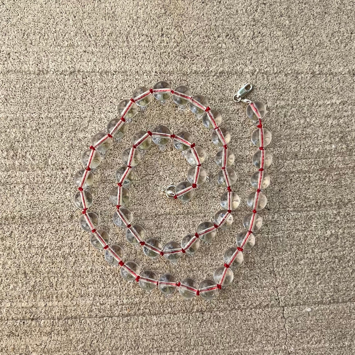 Crystal clear quartz beads
Hand knotted on red silk string
925 sterling silver findings
Chunky statement maximalist minimalist necklace
Chinese east inspired good luck protection prosperity abundance