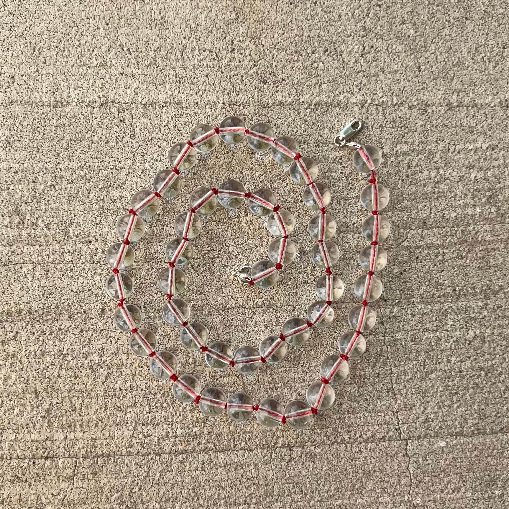 Crystal clear quartz beads
Hand knotted on red silk string
925 sterling silver findings
Chunky statement maximalist minimalist necklace 
Chinese east inspired good luck protection prosperity abundance 